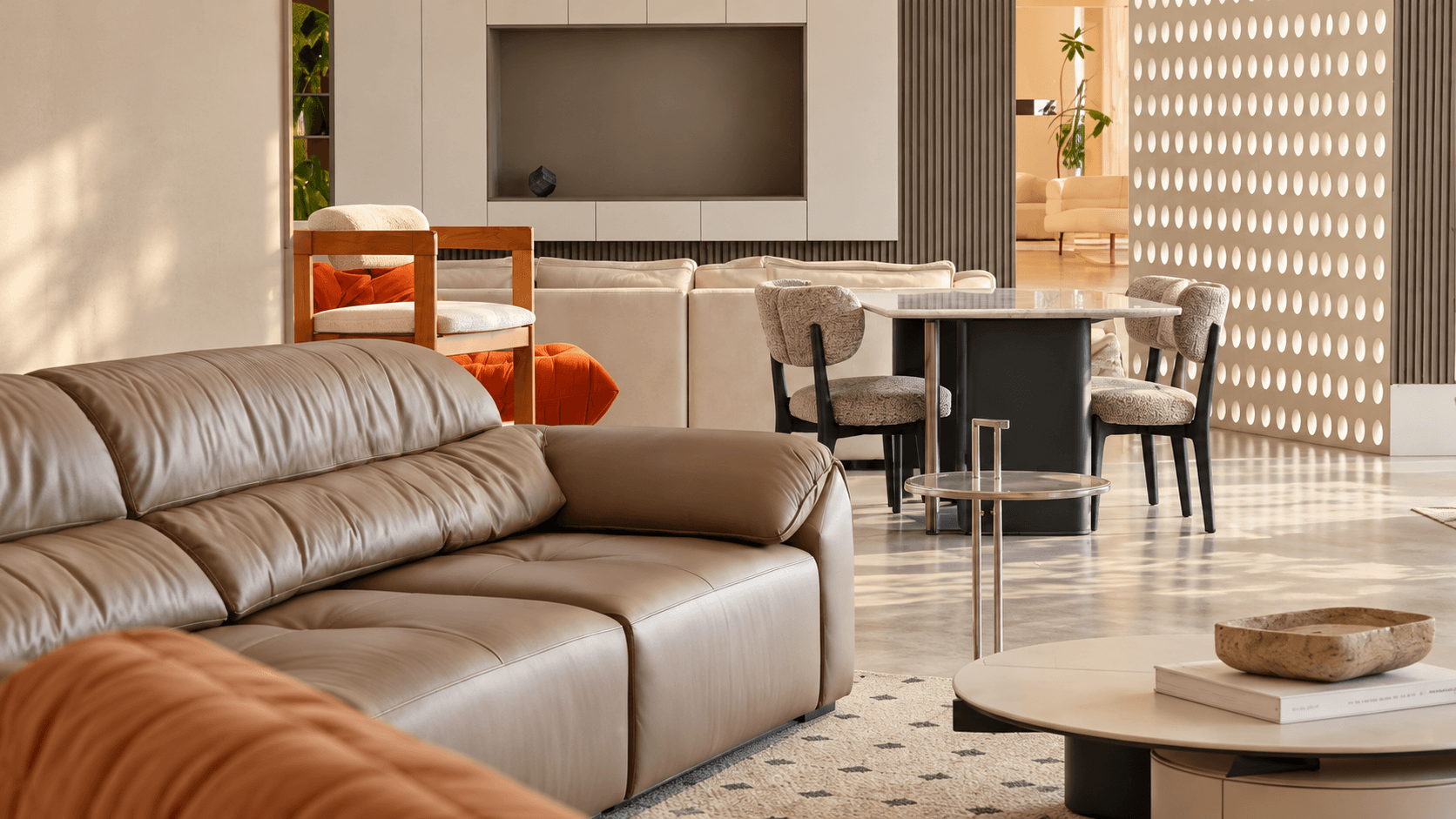 Warm modern showroom with sofas, tables and upholstered chairs