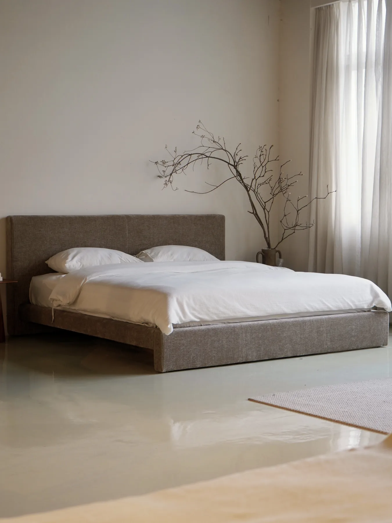 Linear Shadow bed in a warm showroom bedroom